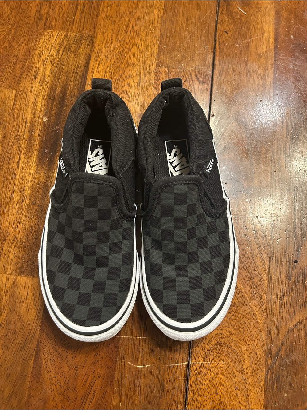Vans Black Checkerboard Slip-On Sneakers